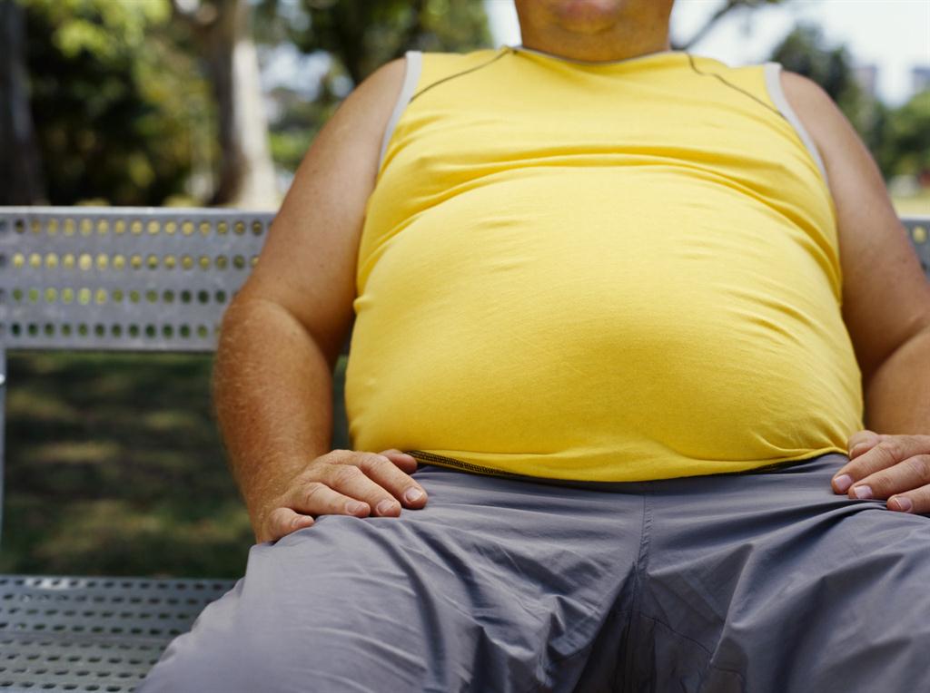 picture of overweight individual sitting on a bench